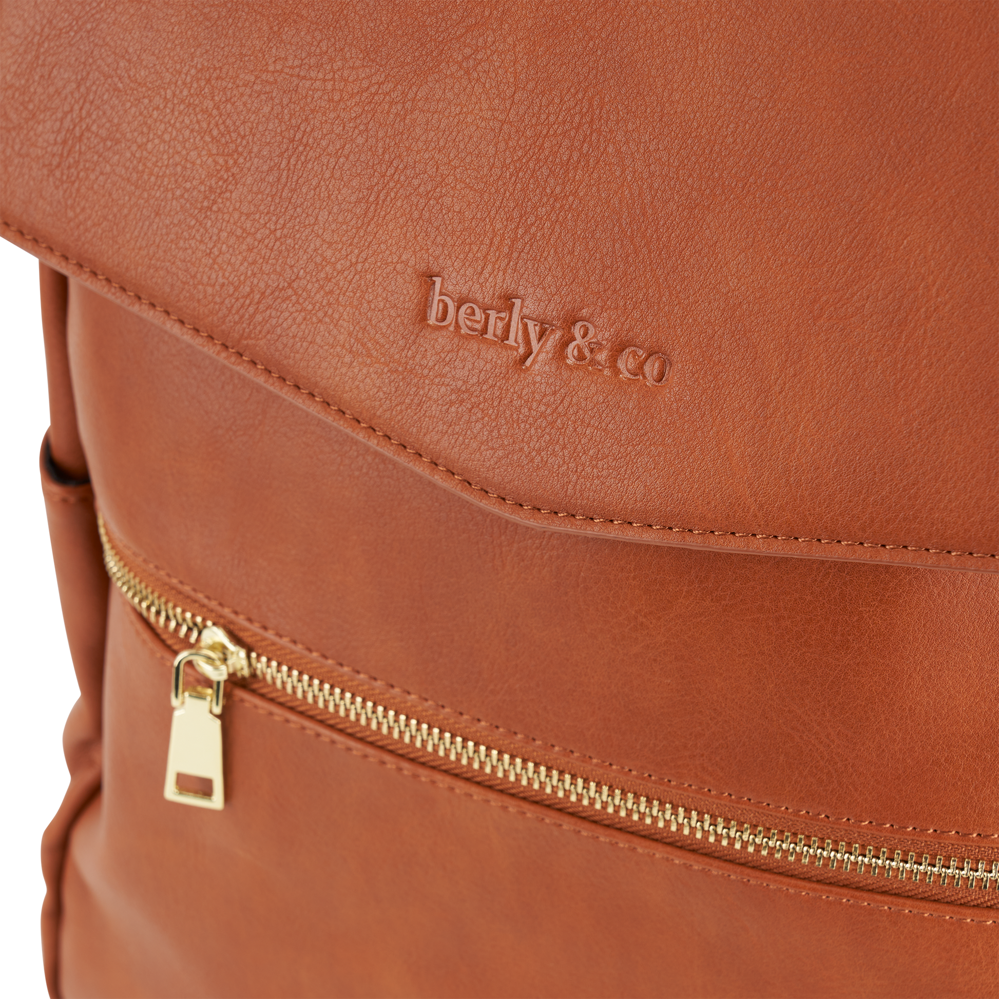 Detail of tan vegan leather texture and premium hardware on Florence Diaper Bag