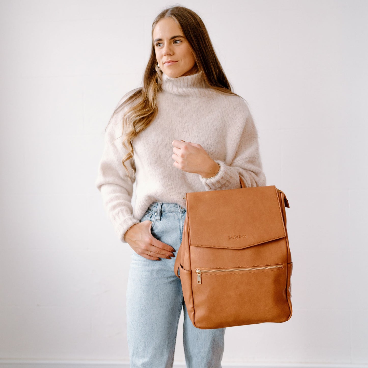 Stylish parent with Florence Tan Nappy Bag used for work
