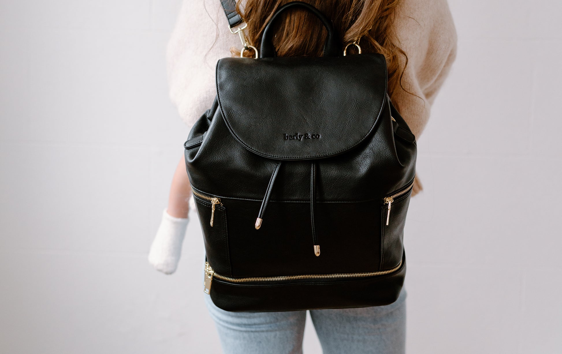 Close-up of taupe vegan leather texture and quality stitching on Florence Diaper Bag