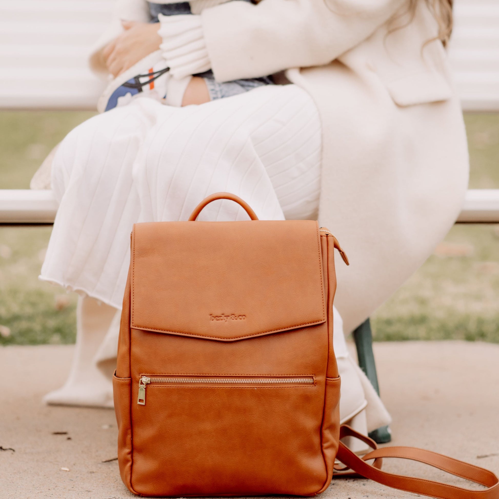 Busy parent with Florence Tan diaper Bag during day out with baby
